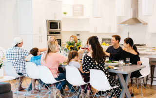 People celebrating Thanksgiving dinner on 30A together